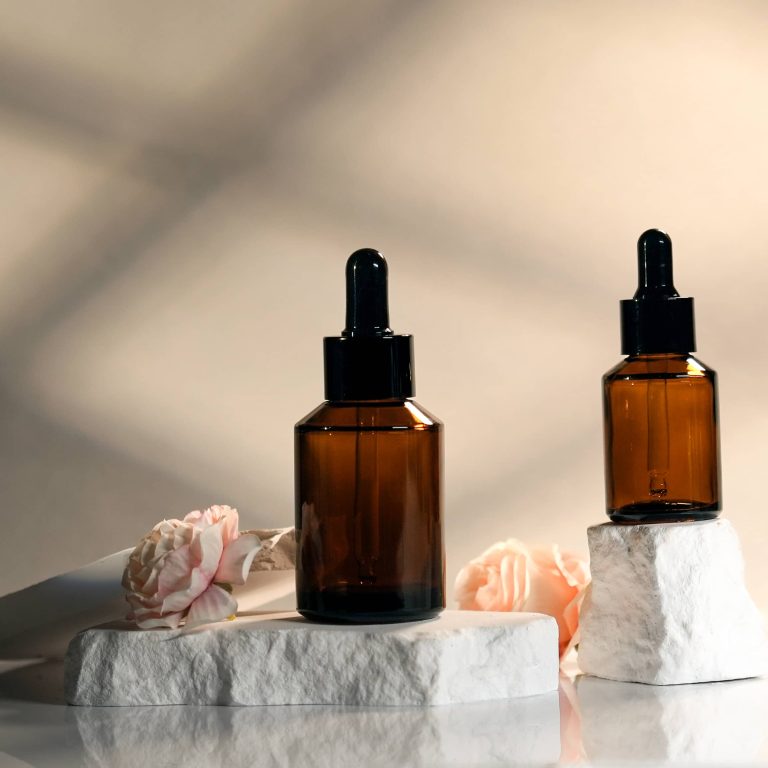 Amber glass skincare dropper bottles with black pipettes