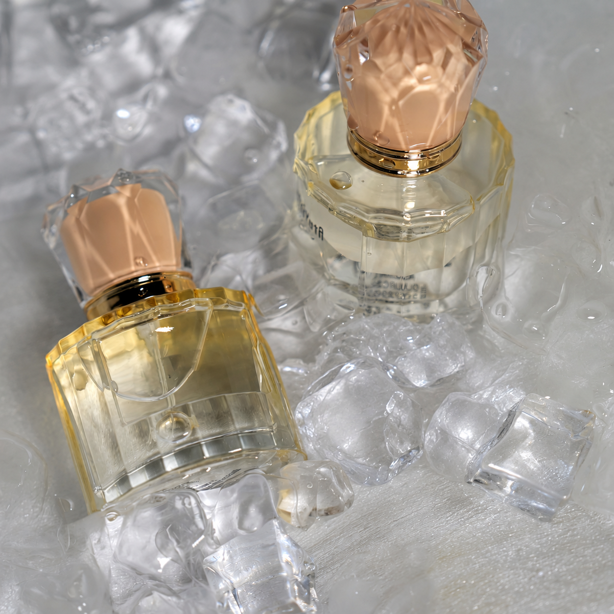 Faceted clear glass perfume bottles with blush caps