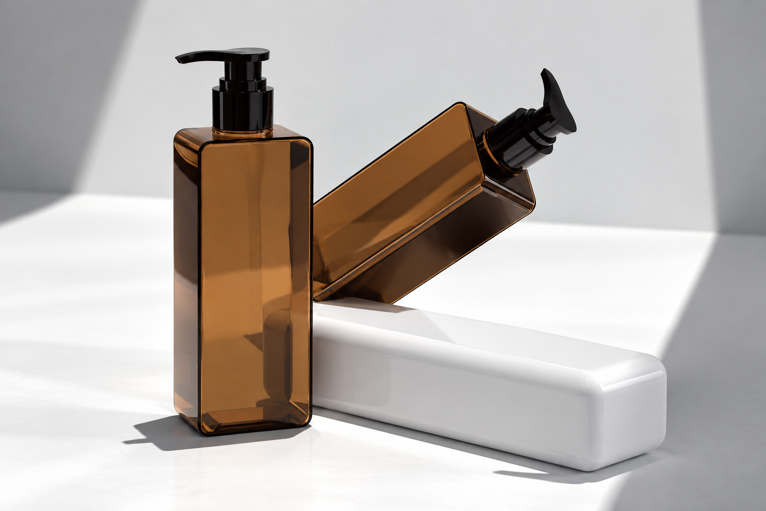 Two views of a transparent amber rectangular pump bottle