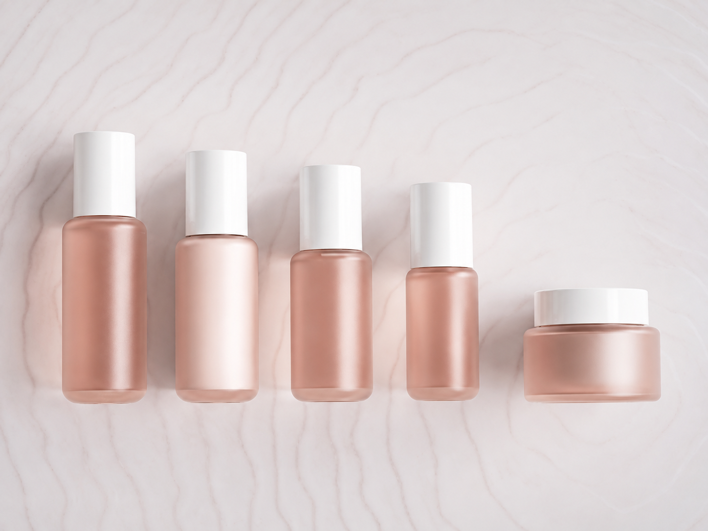 Peach round-shoulder bottles and jar with white caps