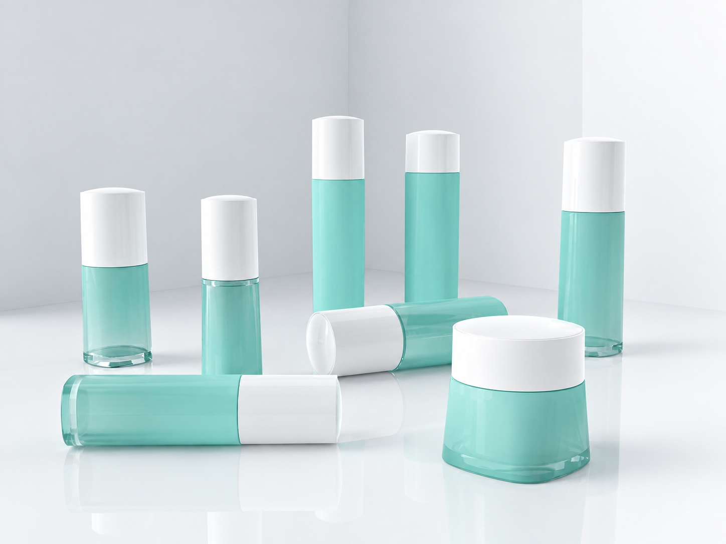 Pale aqua skincare bottles and jar with white caps