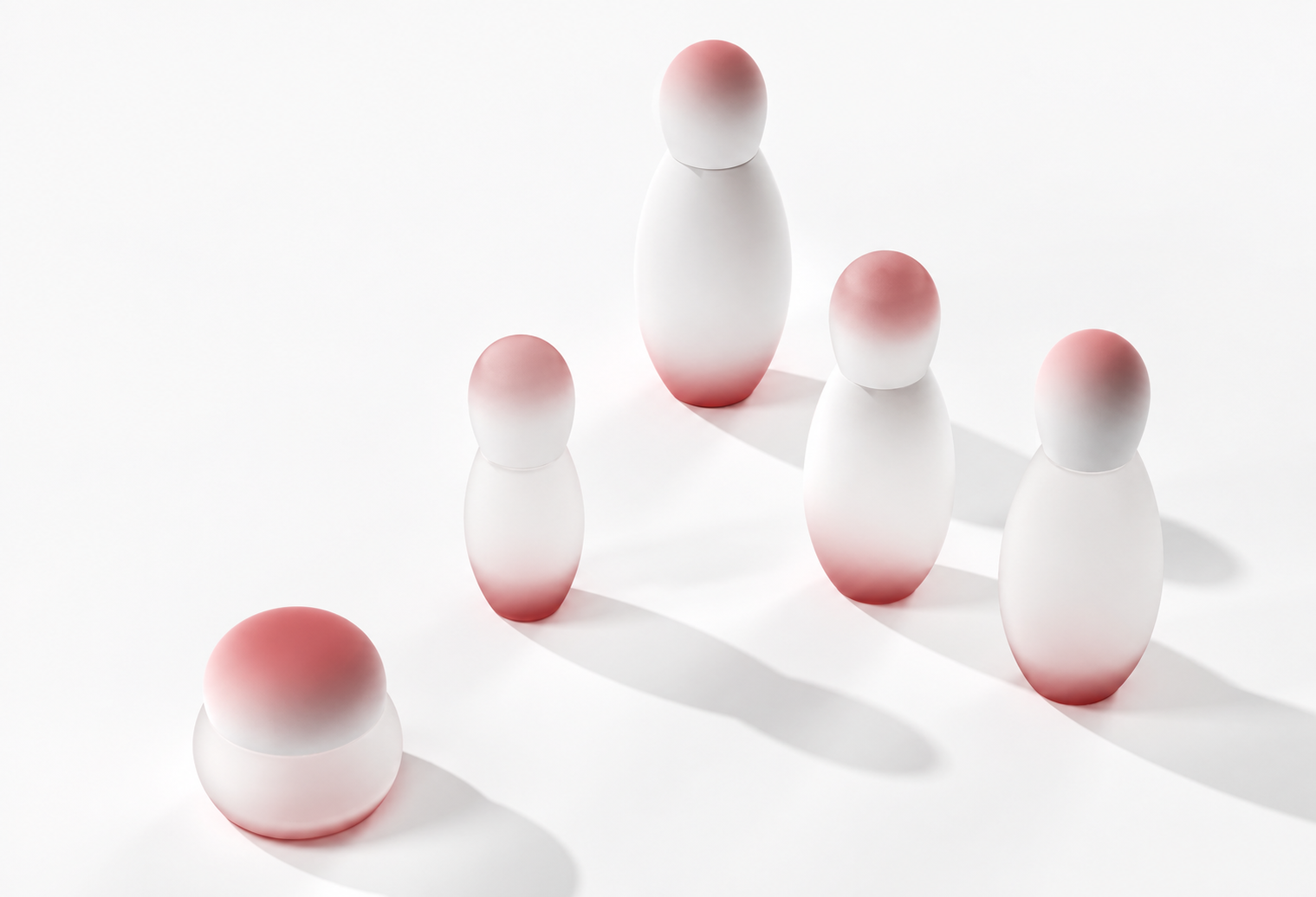 White and blush bowling-shaped skincare bottles and jar