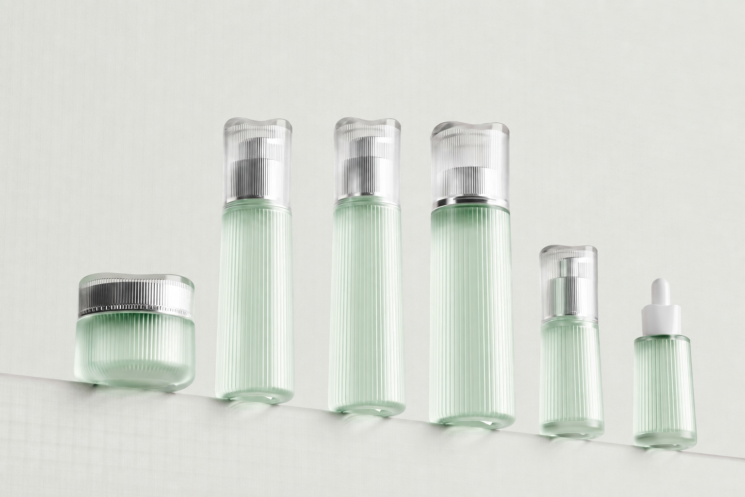 Pale mint ribbed skincare bottles and jar